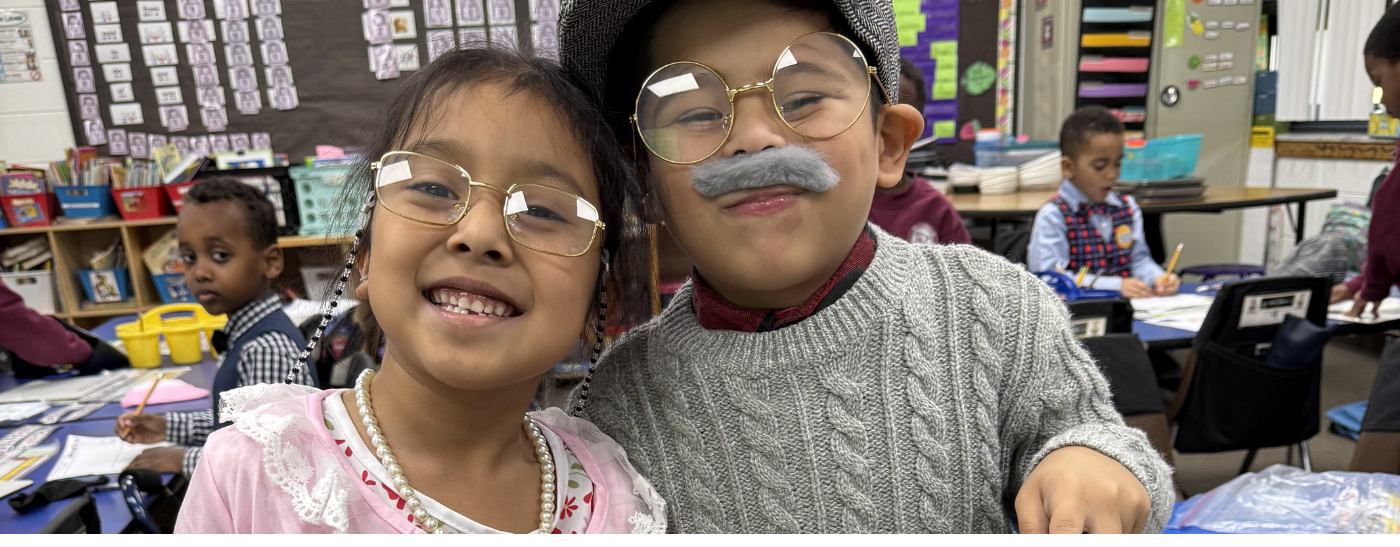 Joyful elementary students celebrating the 100th day of school